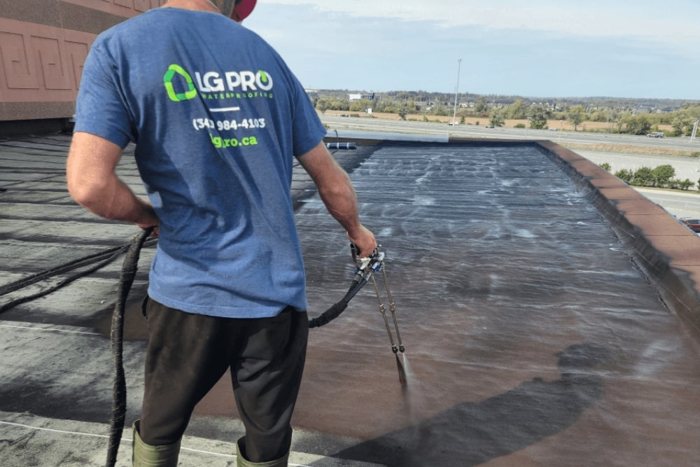LG Pro applying a waterproof coating on a commercial roof