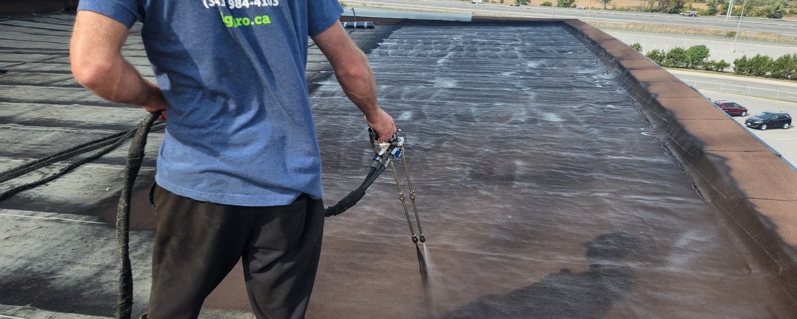 LG Pro applying roof coating